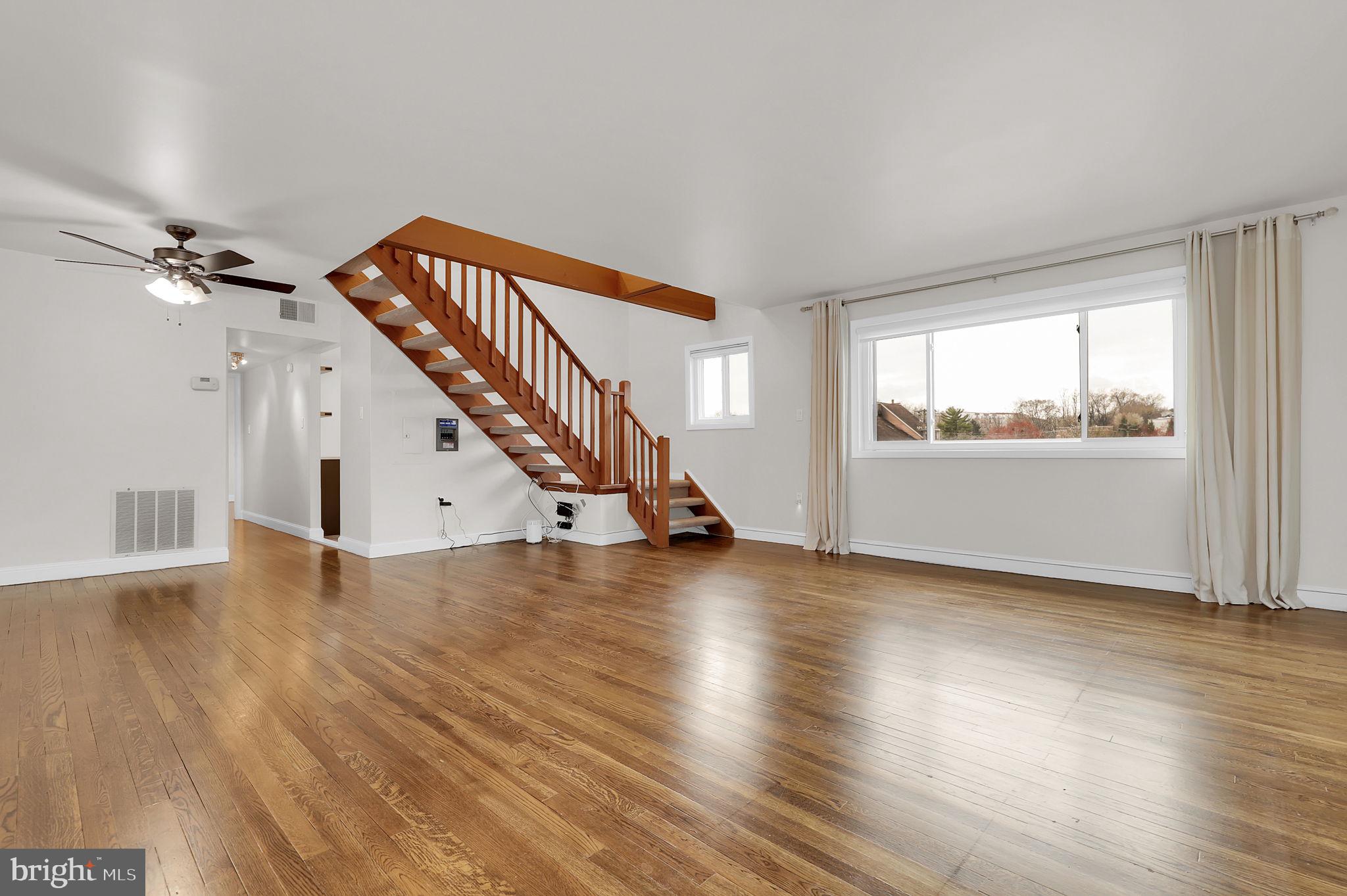 11514 Bucknell Drive, Unit 202 Silver Spring, MD 20902 - Photo 1 of 31 a view of empty room with wooden floor and fan