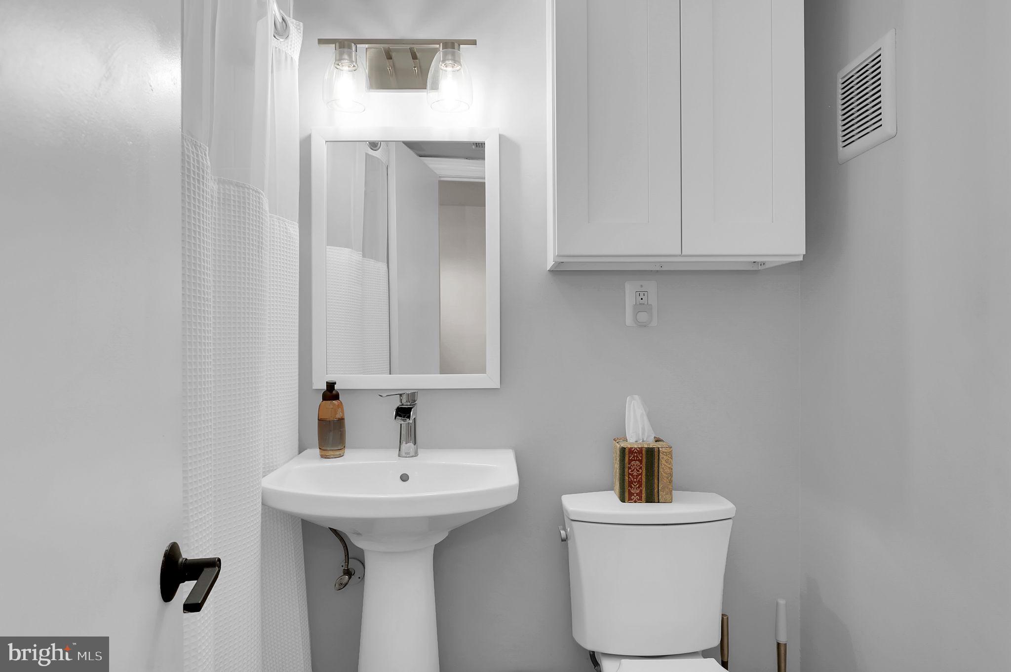 11514 Bucknell Drive, Unit 202 Silver Spring, MD 20902 - Photo 12 of 31 a bathroom with a sink and a toilet