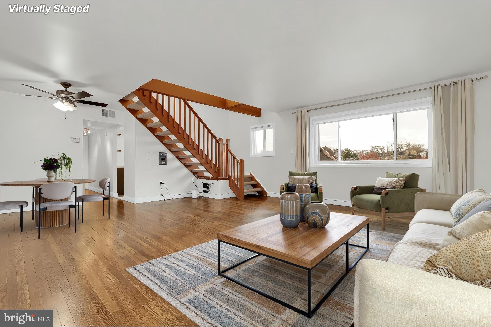 11514 Bucknell Drive, Unit 202 Silver Spring, MD 20902 - Photo 2 of 31 a living room with furniture and a large window