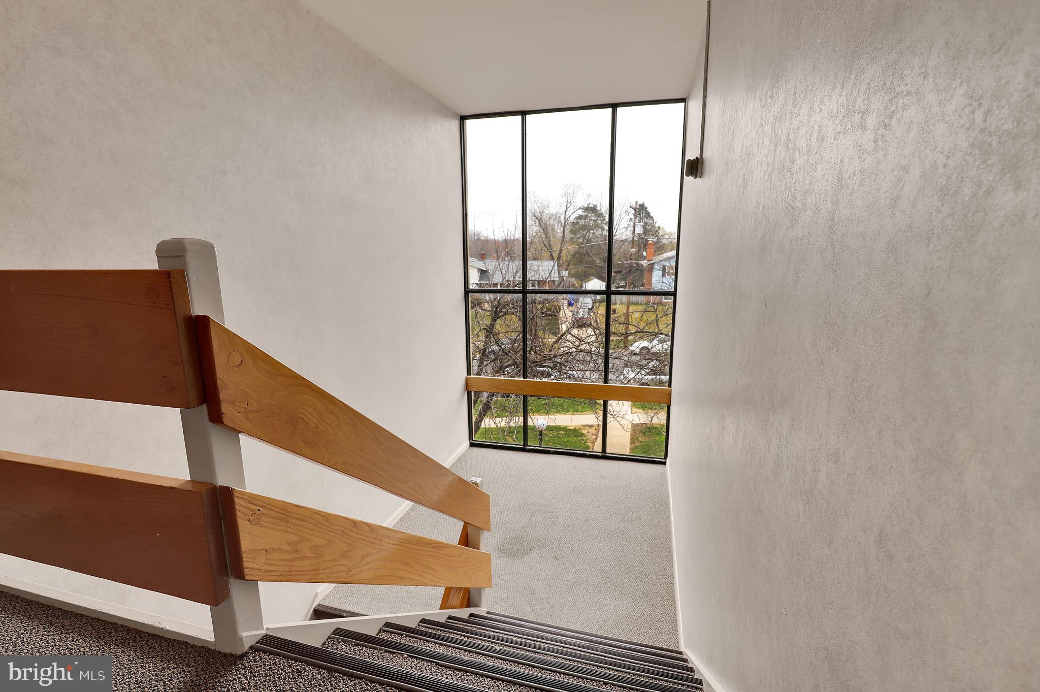 11514 Bucknell Drive, Unit 202 Silver Spring, MD 20902 - Photo 26 of 31 a view of an empty room with wooden floor
