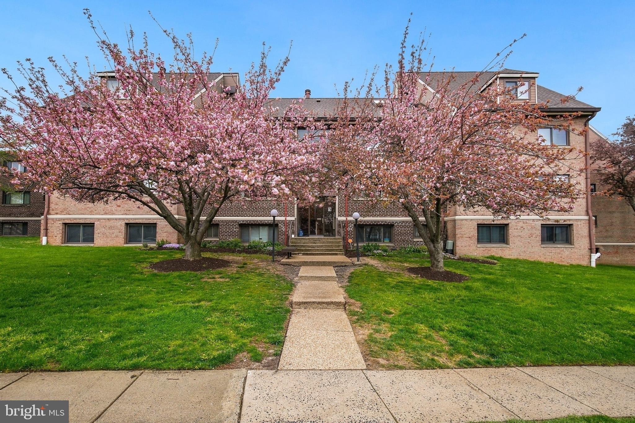 11514 Bucknell Drive, Unit 202 Silver Spring, MD 20902 - Photo 27 of 31 front view of a house with a yard
