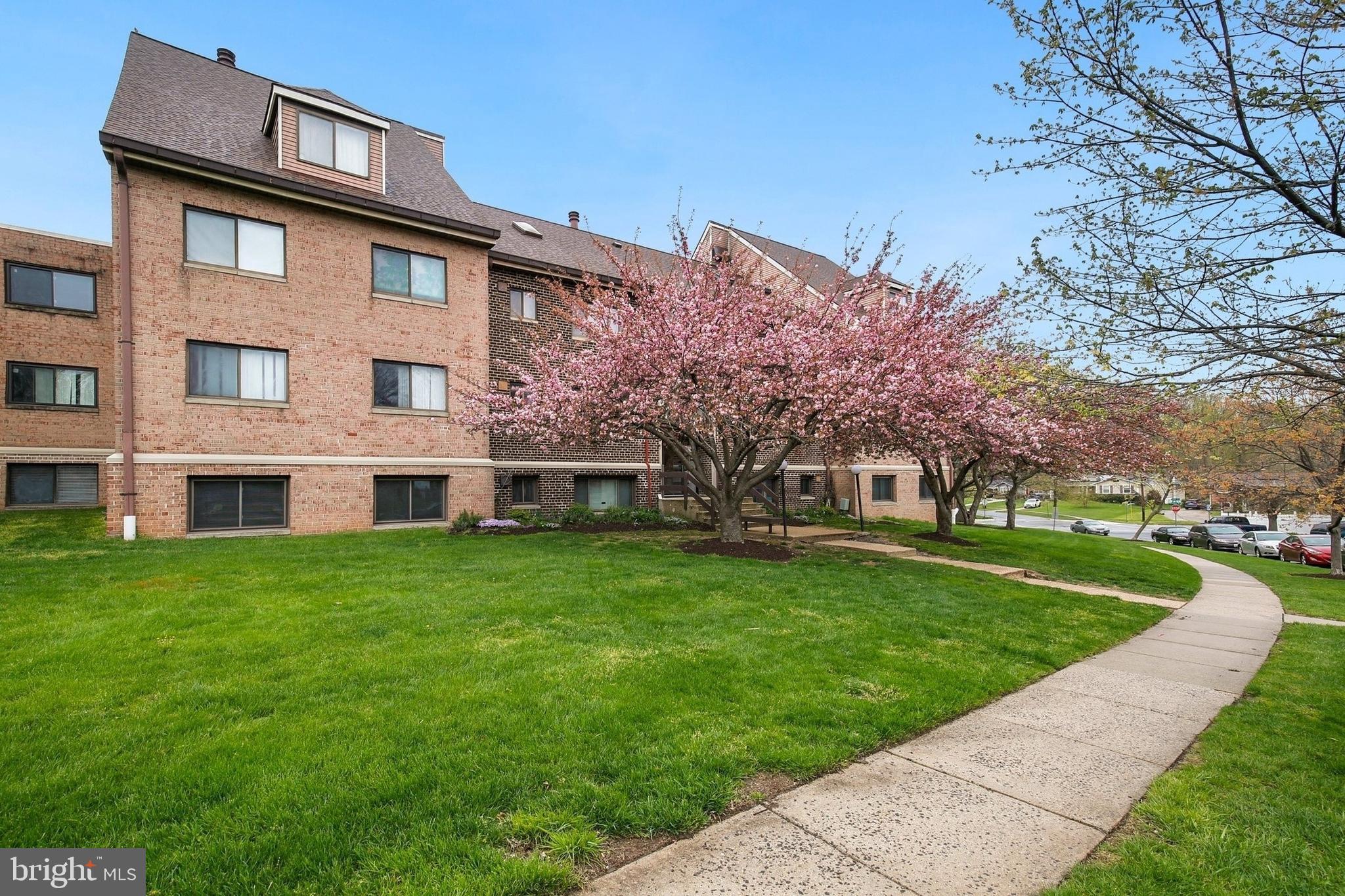 11514 Bucknell Drive, Unit 202 Silver Spring, MD 20902 - Photo 28 of 31 a front view of a house with garden