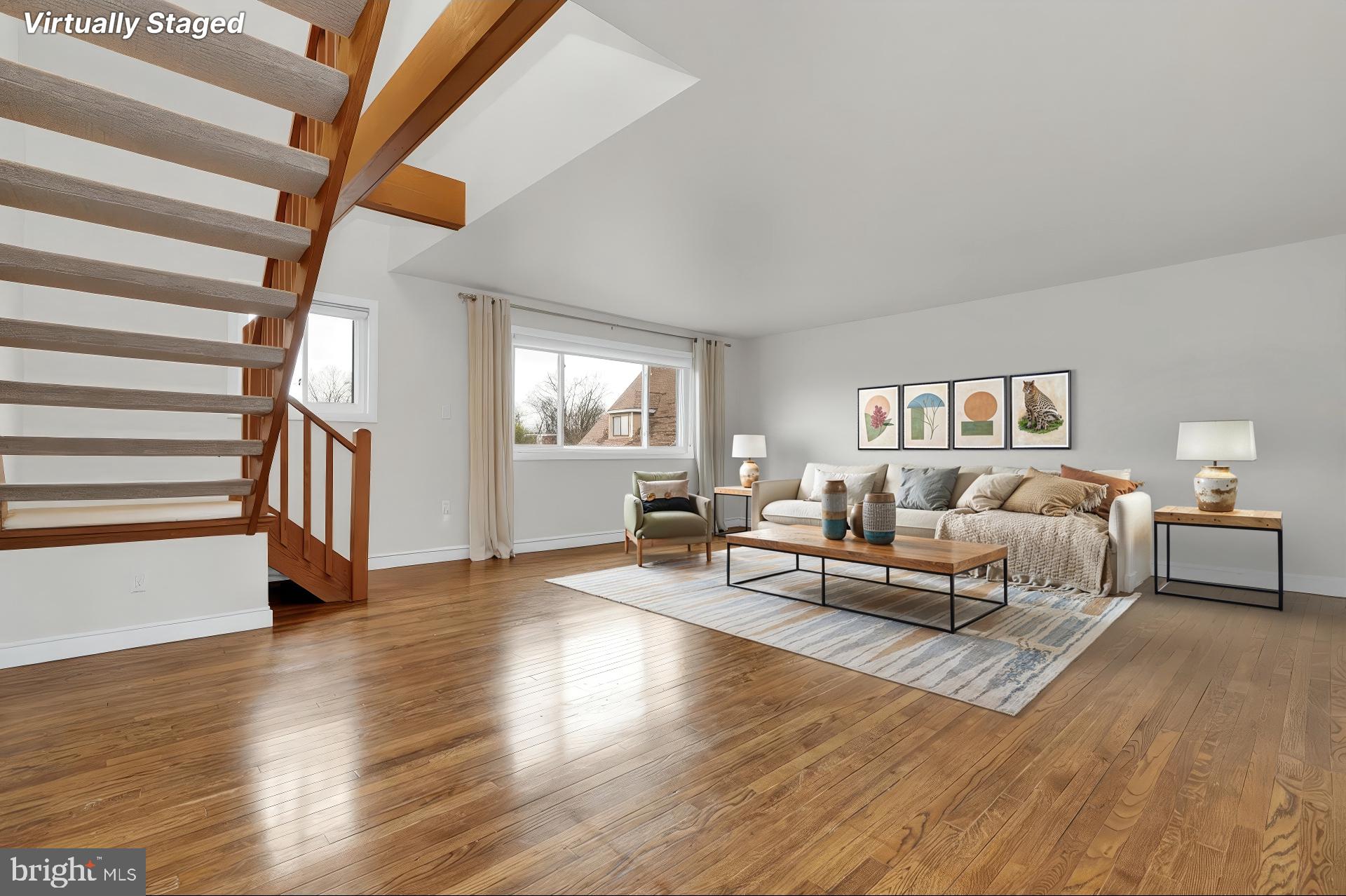 11514 Bucknell Drive, Unit 202 Silver Spring, MD 20902 - Photo 6 of 31 a living room with furniture and a wooden floor