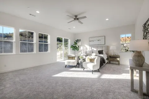a living room with furniture and white walls
