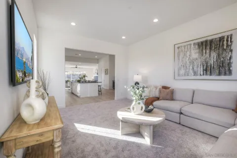 a kitchen with a dining table chairs and refrigerator