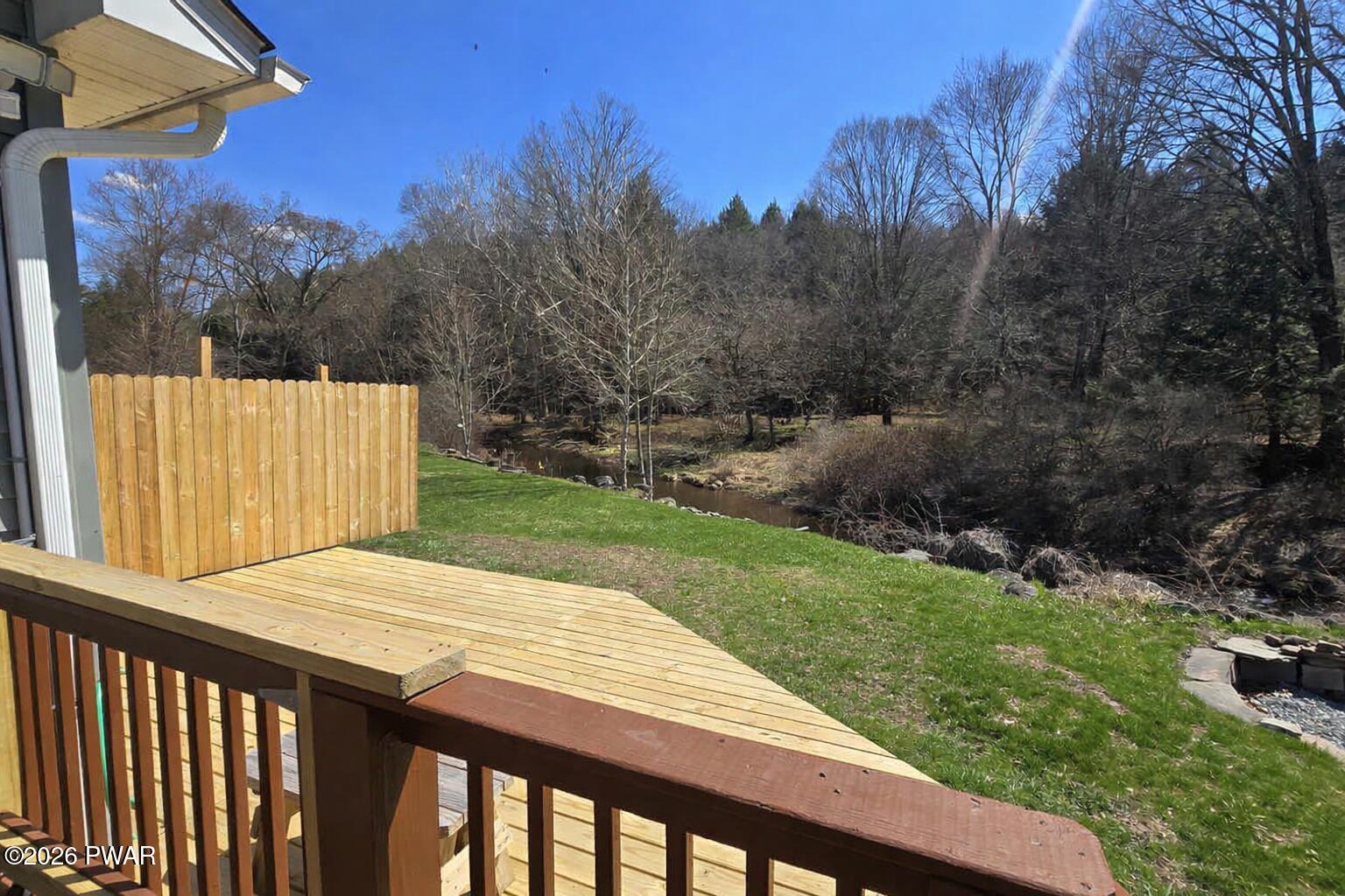 430 Griffith Road Tyler Hill, PA 18469 - Photo 30 of 31 a view of a backyard with wooden fence