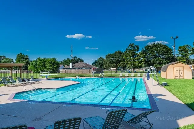 a view of an outdoor space pool patio and outdoor kitchen