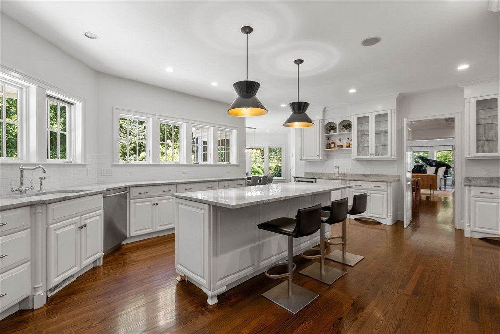 5 Beard Way Wellesley, MA 02482 - Photo 12 of 36 a kitchen with center island and wooden floors