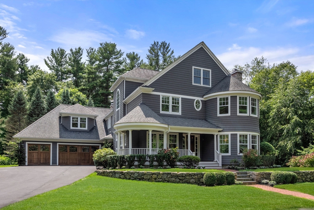 5 Beard Way Wellesley, MA 02482 - Photo 2 of 36 a front view of a house with a yard and trees