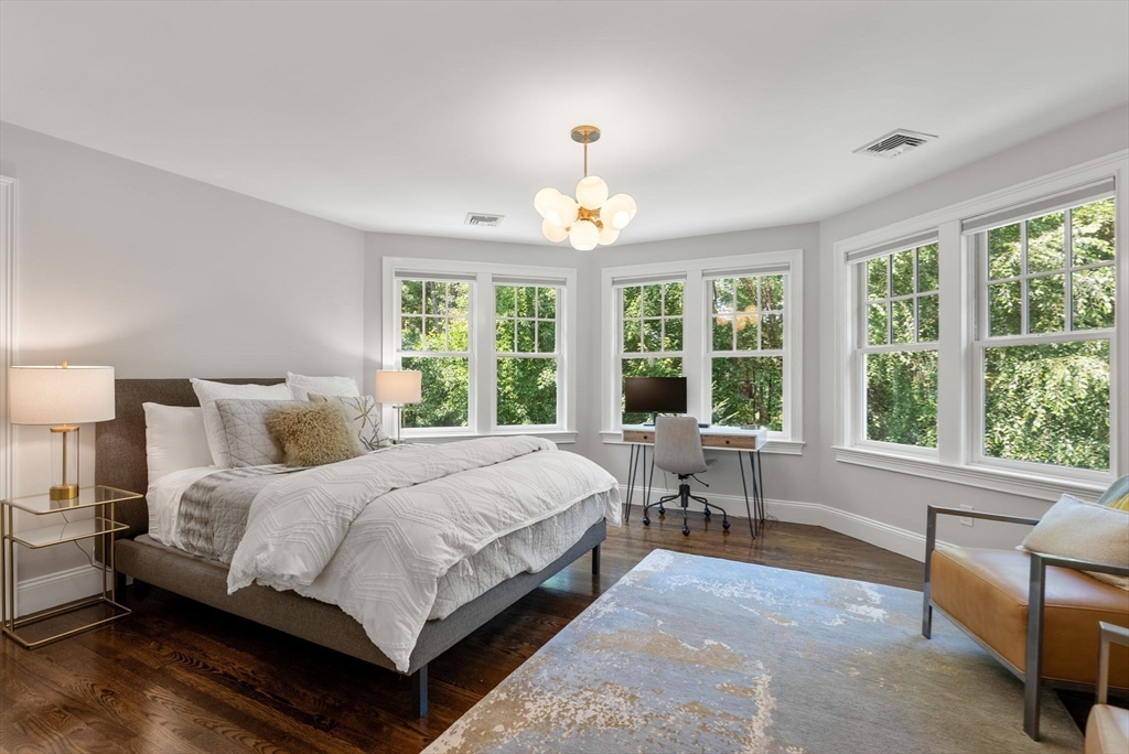 5 Beard Way Wellesley, MA 02482 - Photo 28 of 36 a spacious bedroom with a bed and a large window