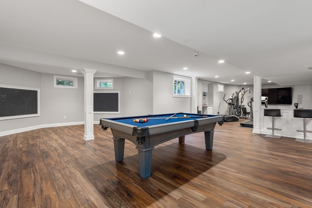 5 Beard Way Wellesley, MA 02482 - Photo 34 of 36 a room with wooden floor and furniture