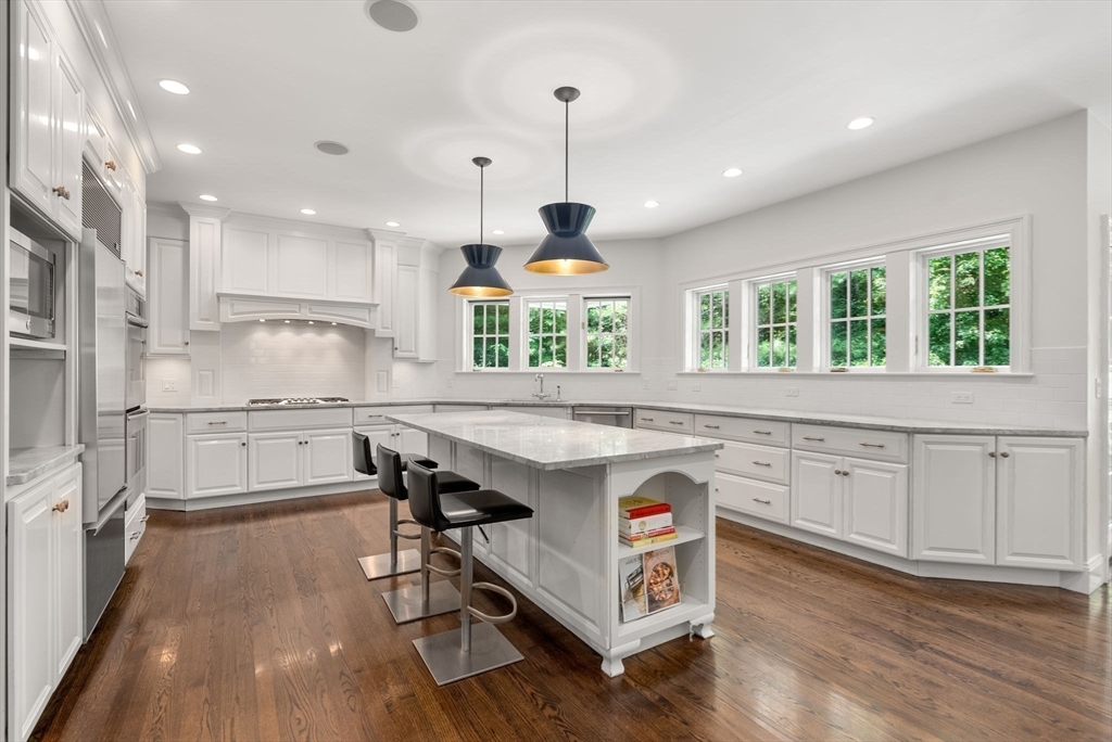 5 Beard Way Wellesley, MA 02482 - Photo 10 of 36 a kitchen with kitchen island granite countertop a stove a sink a refrigerator and wooden floor
