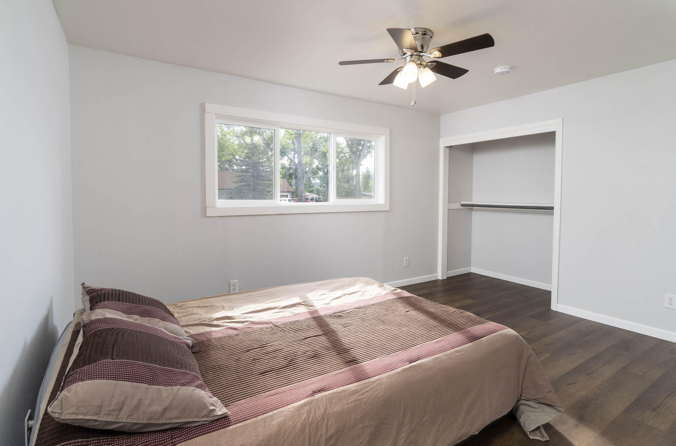 61139 Parrell Road Bend, OR 97702 - Photo 8 of 16 Both spacious sun-filled bedrooms with new wood floors.