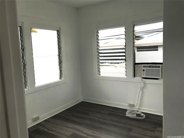 a bathroom with a toilet sink and window