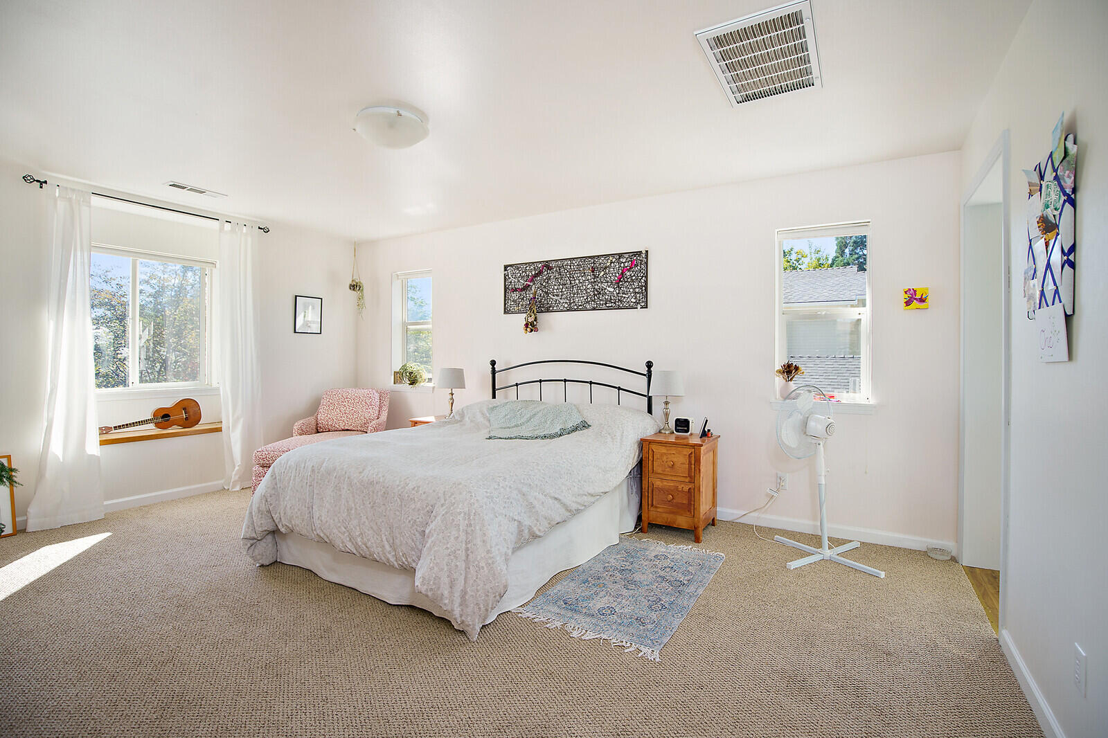 1399 Mill Pond Road Ashland, OR 97520 - Photo 18 of 28 a bedroom with a bed and a couch