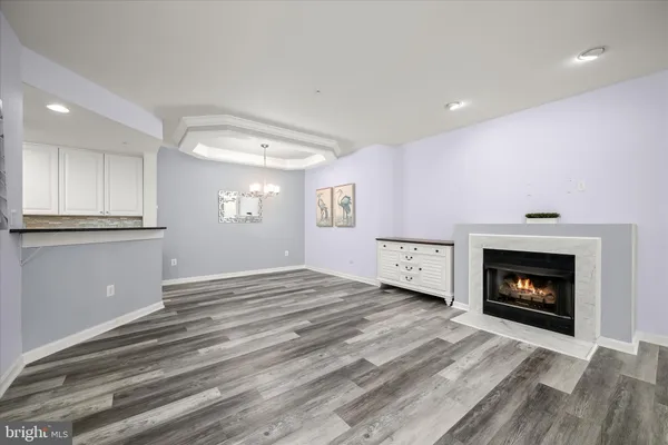 a view of an empty room and a fireplace