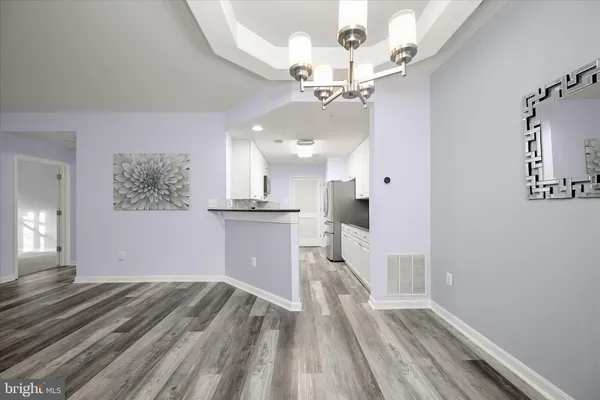 a view of livingroom with furniture wooden floor window and fireplace