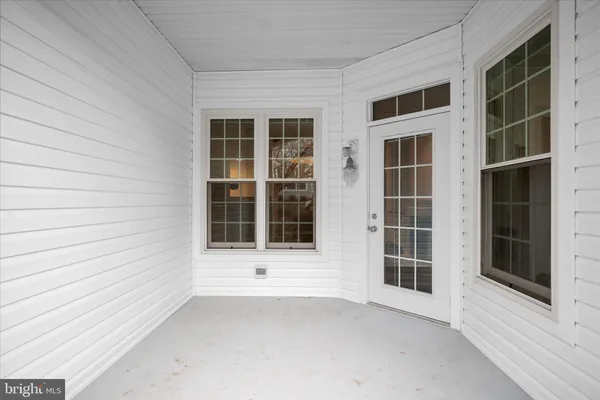 a utility room with cabinets washer and dryer