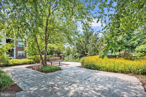 a view of a house with backyard sitting area and garden