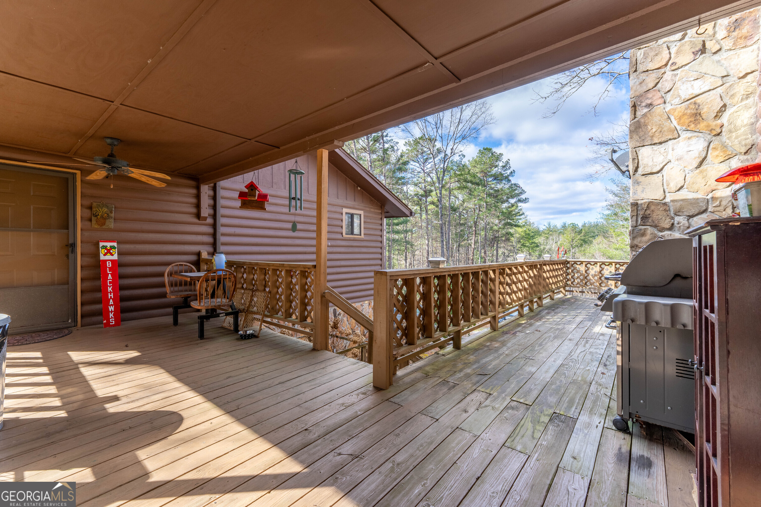 300 Sandy Gap Road Murphy, NC 28906 - Photo 11 of 48 a view of a roof deck with wooden floor and fence