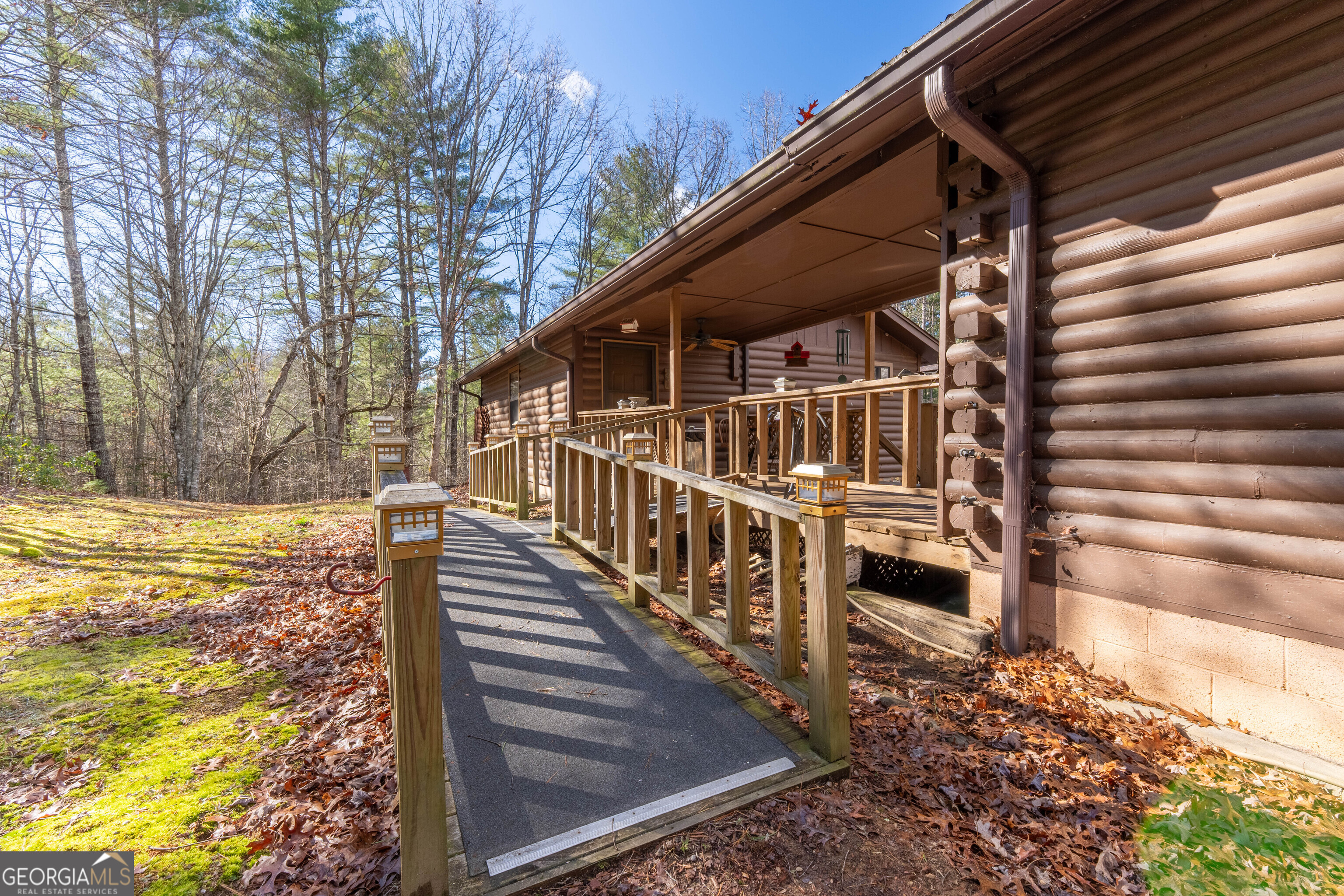 300 Sandy Gap Road Murphy, NC 28906 - Photo 16 of 48 a view of backyard with wooden fence and large trees