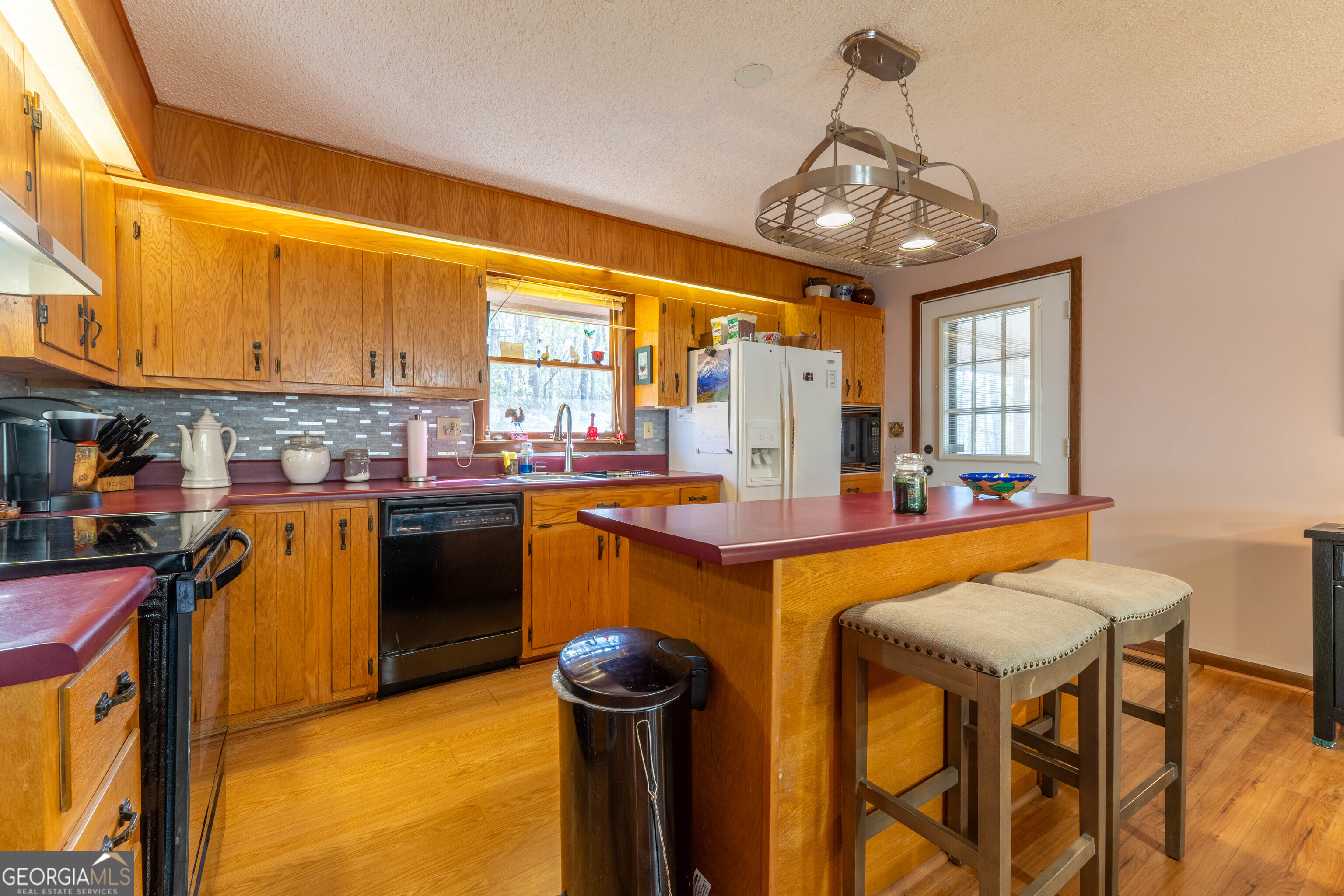 300 Sandy Gap Road Murphy, NC 28906 - Photo 22 of 48 a kitchen with stainless steel appliances granite countertop a sink and a refrigerator