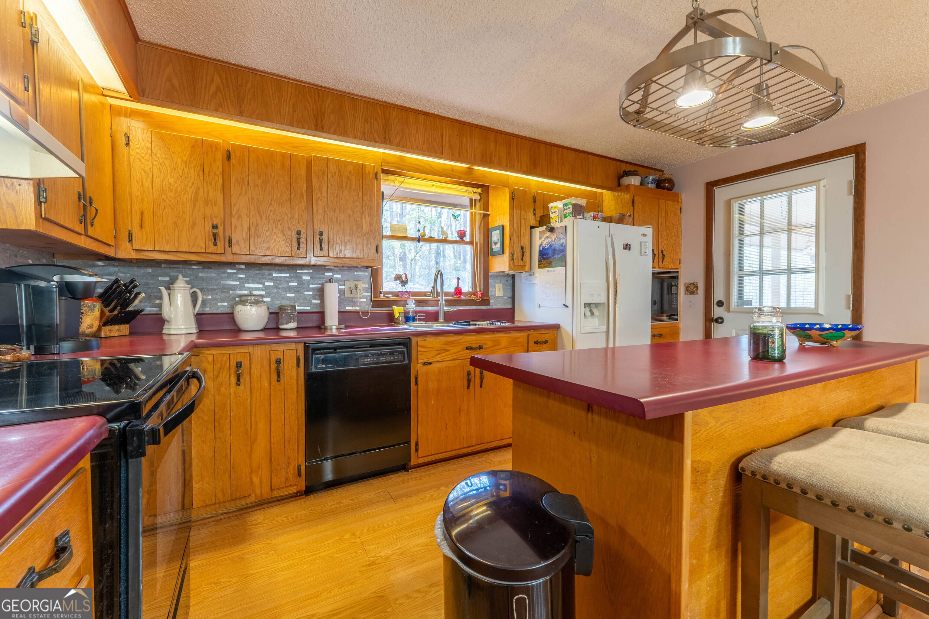 300 Sandy Gap Road Murphy, NC 28906 - Photo 23 of 48 a kitchen that has a lot of cabinets in it