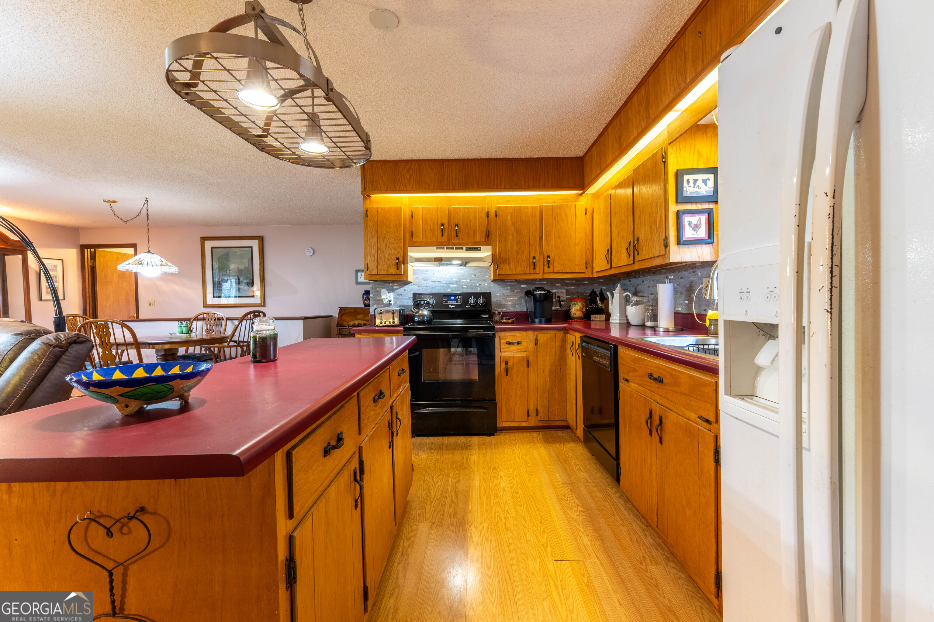 300 Sandy Gap Road Murphy, NC 28906 - Photo 24 of 48 a kitchen with stainless steel appliances granite countertop a sink and cabinets