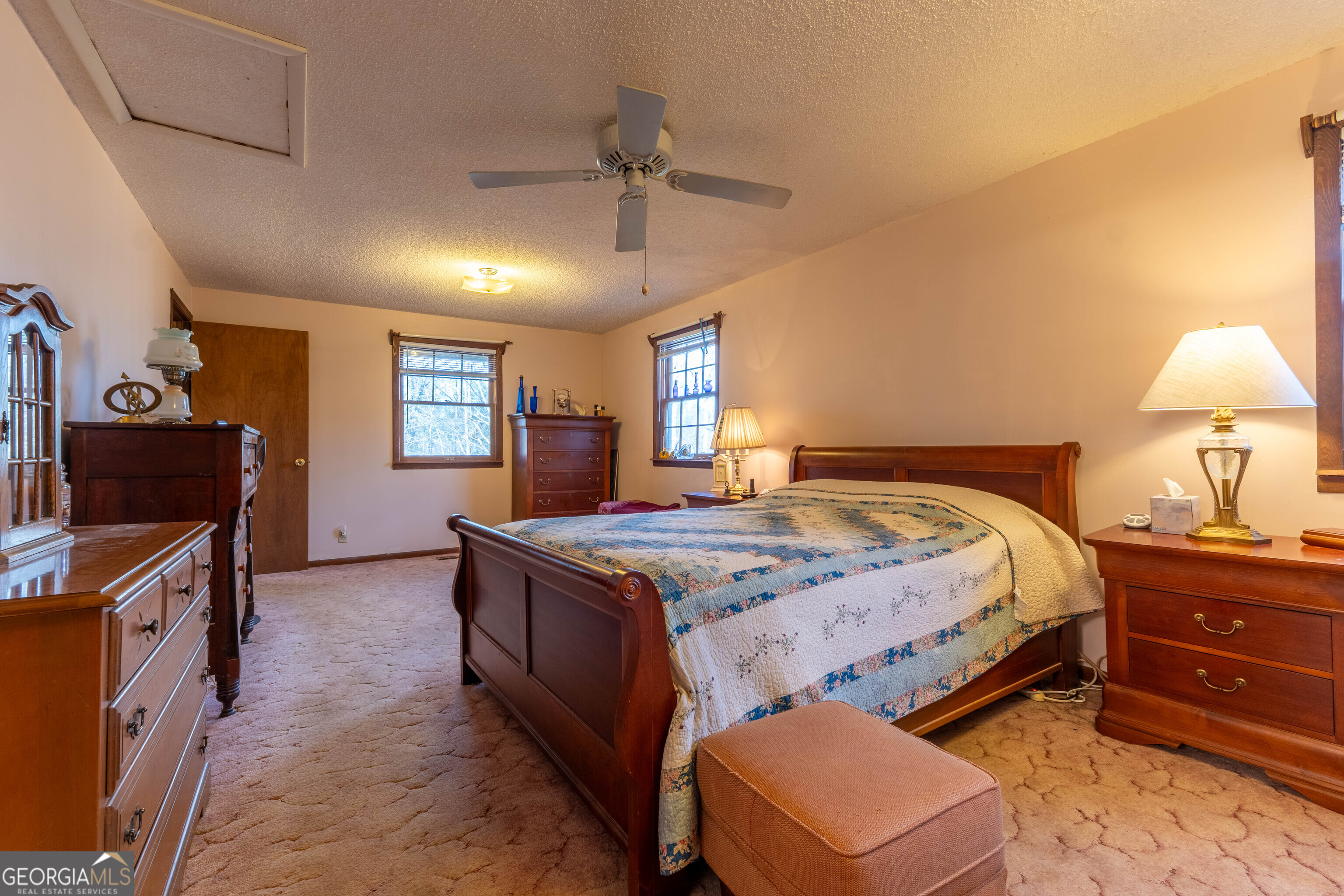 300 Sandy Gap Road Murphy, NC 28906 - Photo 27 of 48 a spacious bedroom with a bed and a dresser