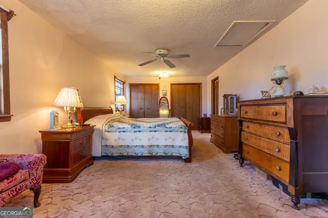 a bedroom with furniture and a dresser