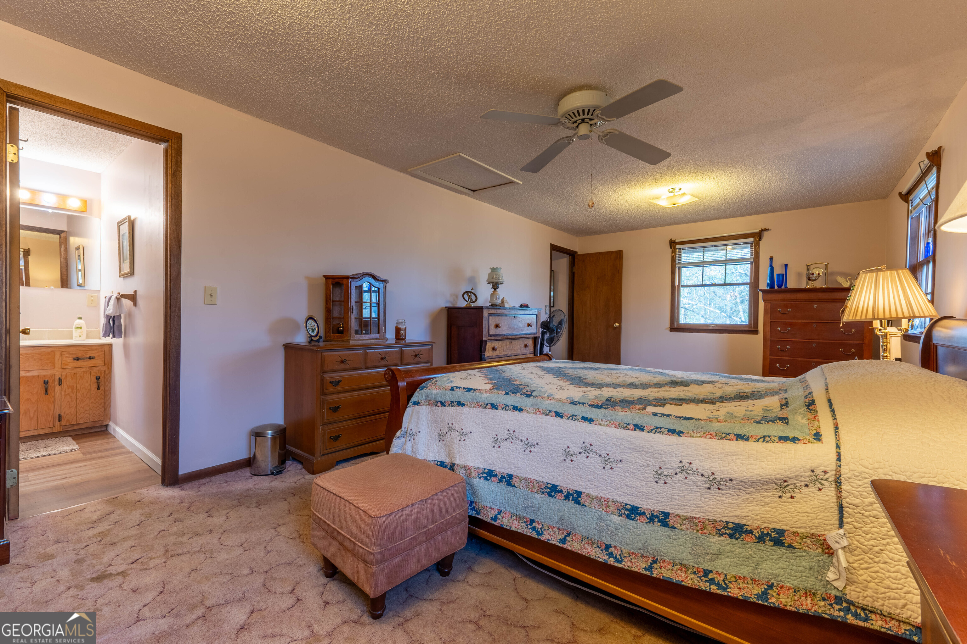 300 Sandy Gap Road Murphy, NC 28906 - Photo 30 of 48 a bed room with a bed mirror and a chair
