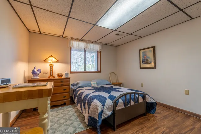 a bedroom with a bed and a table