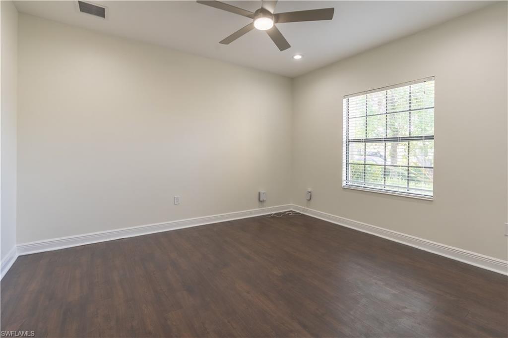 3549 Canopy Circle Naples, FL 34120 - Photo 18 of 50 an empty room with a window and a fan