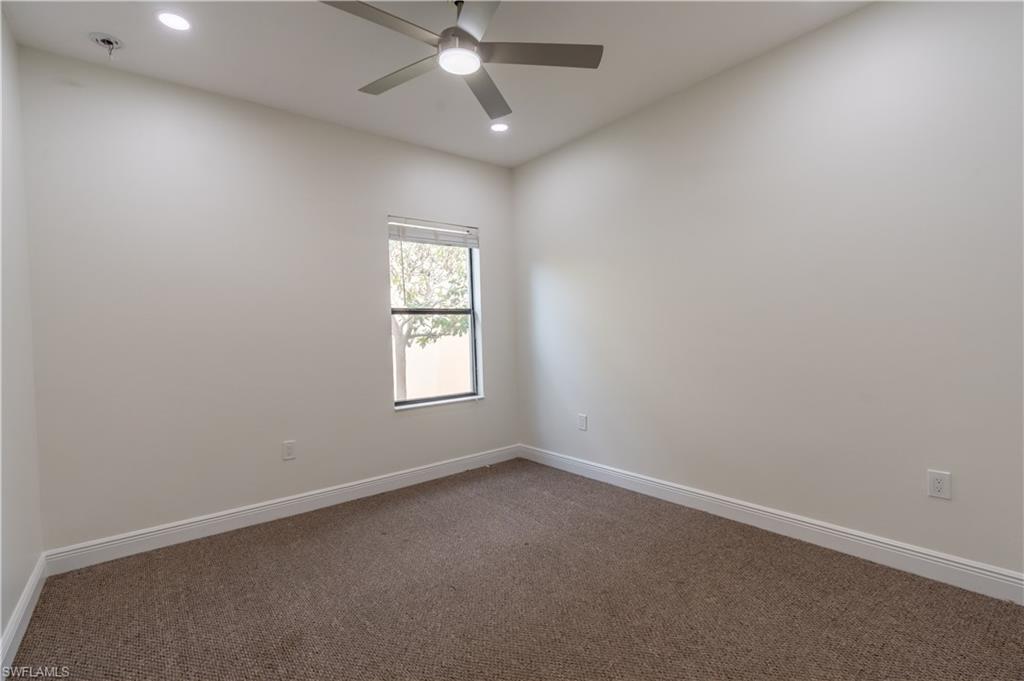 3549 Canopy Circle Naples, FL 34120 - Photo 24 of 50 an empty room with a window and a fan