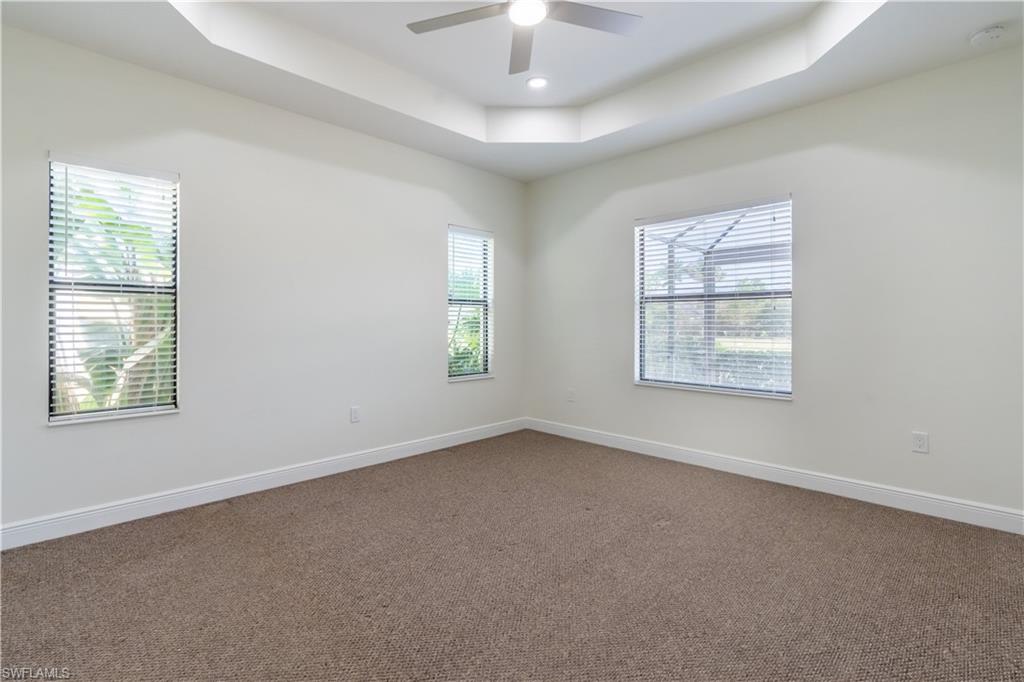 3549 Canopy Circle Naples, FL 34120 - Photo 26 of 50 an empty room with a window and a fan