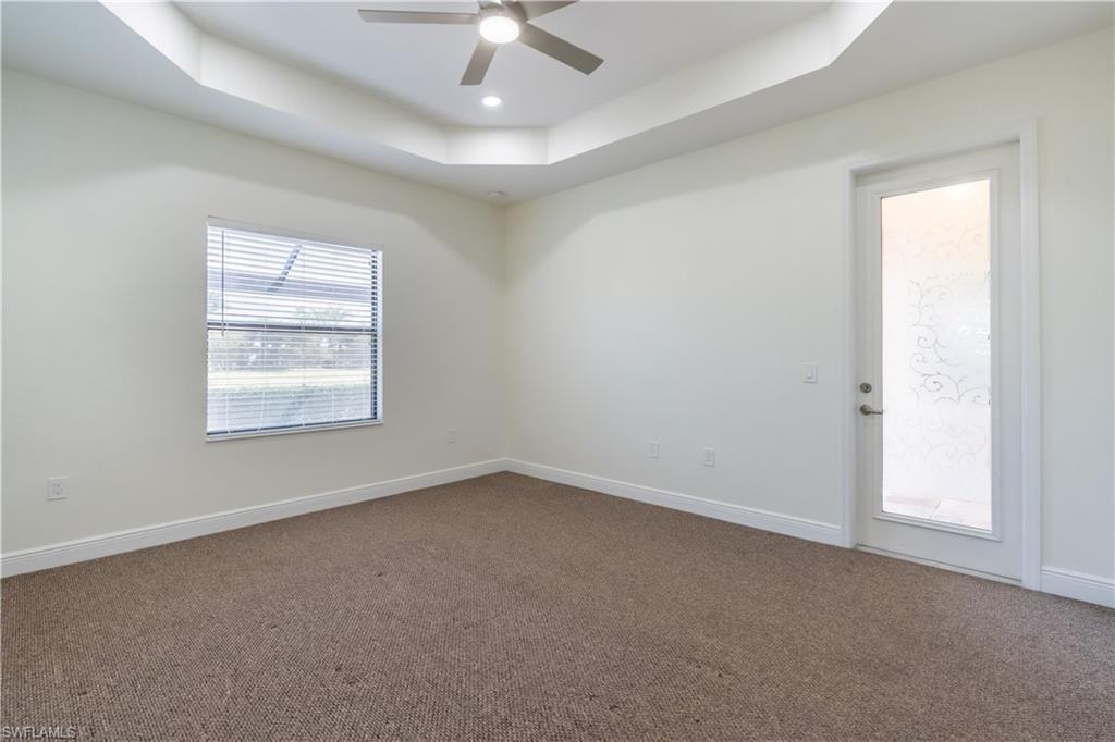 3549 Canopy Circle Naples, FL 34120 - Photo 27 of 50 an empty room with a window and a ceiling fan