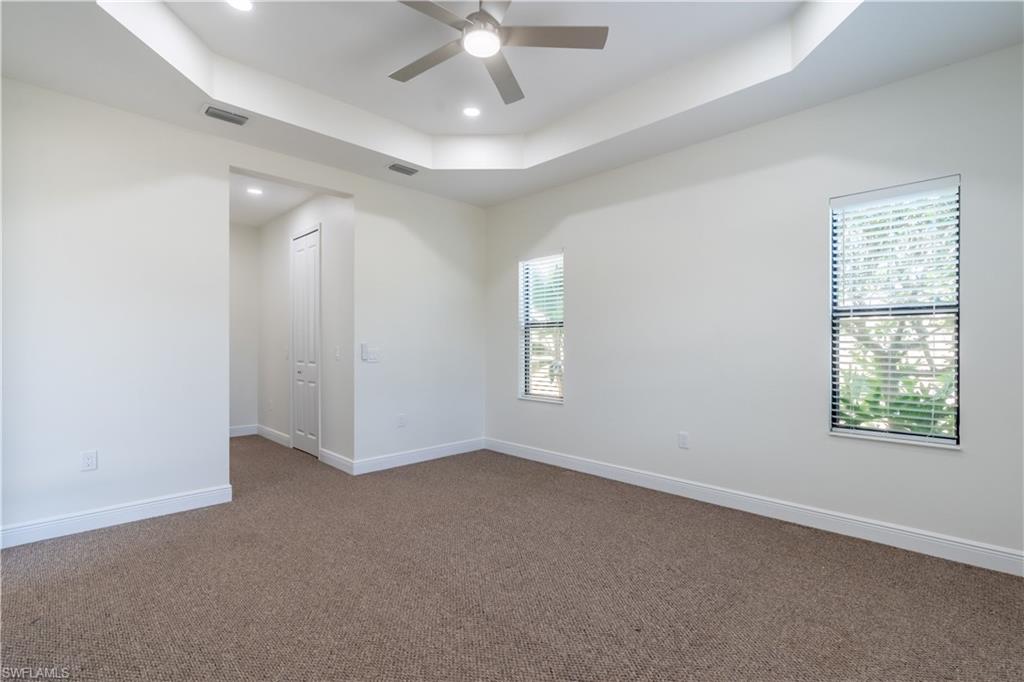 3549 Canopy Circle Naples, FL 34120 - Photo 28 of 50 wooden floor in an empty room with a window