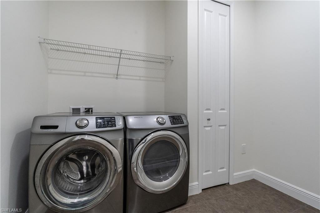 3549 Canopy Circle Naples, FL 34120 - Photo 29 of 50 a utility room with dryer and washer
