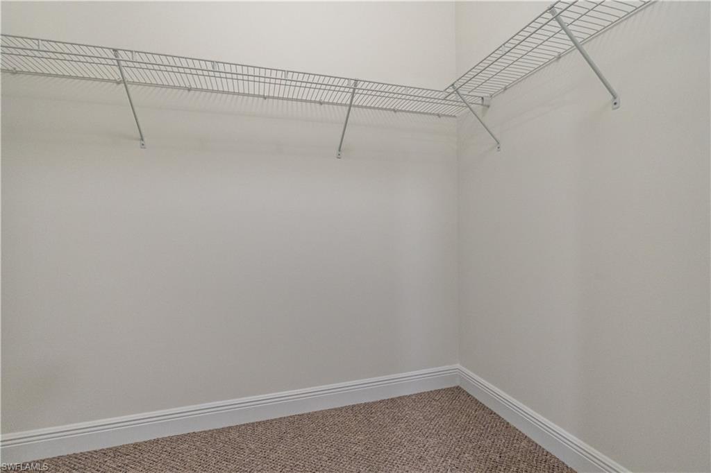 3549 Canopy Circle Naples, FL 34120 - Photo 32 of 50 a view of a room with racks on the wall