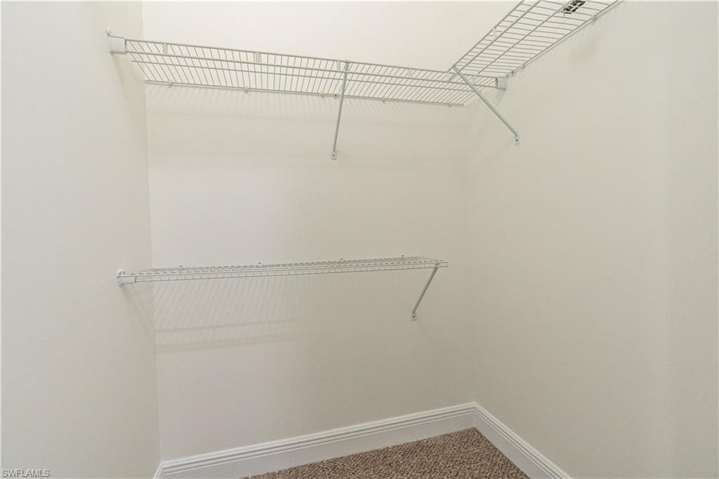 3549 Canopy Circle Naples, FL 34120 - Photo 33 of 50 a view of a room with racks on the wall
