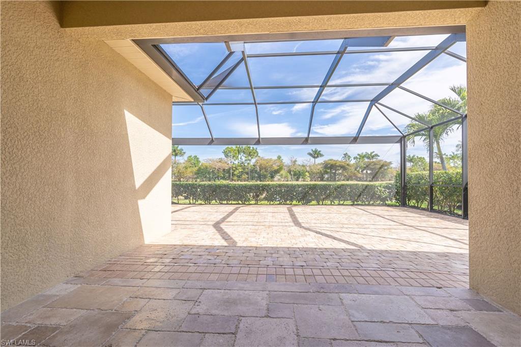 3549 Canopy Circle Naples, FL 34120 - Photo 35 of 50 a view of empty room with wooden floor and fan