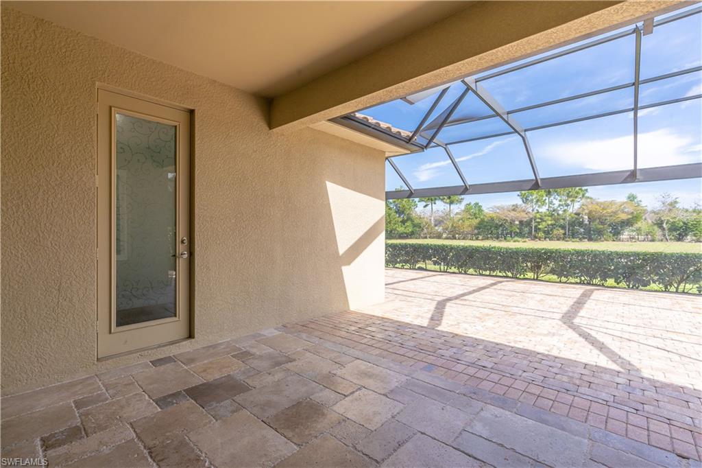 3549 Canopy Circle Naples, FL 34120 - Photo 36 of 50 a view of a room with a window and yard