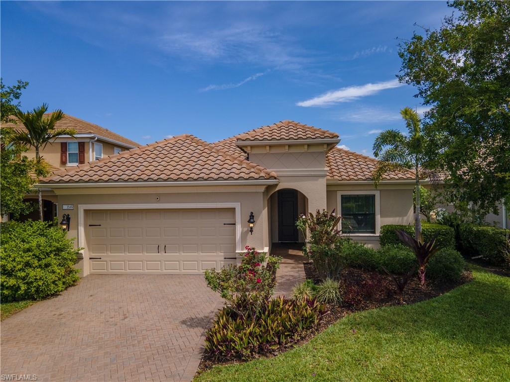 3549 Canopy Circle Naples, FL 34120 - Photo 47 of 50 a front view of a house with a yard