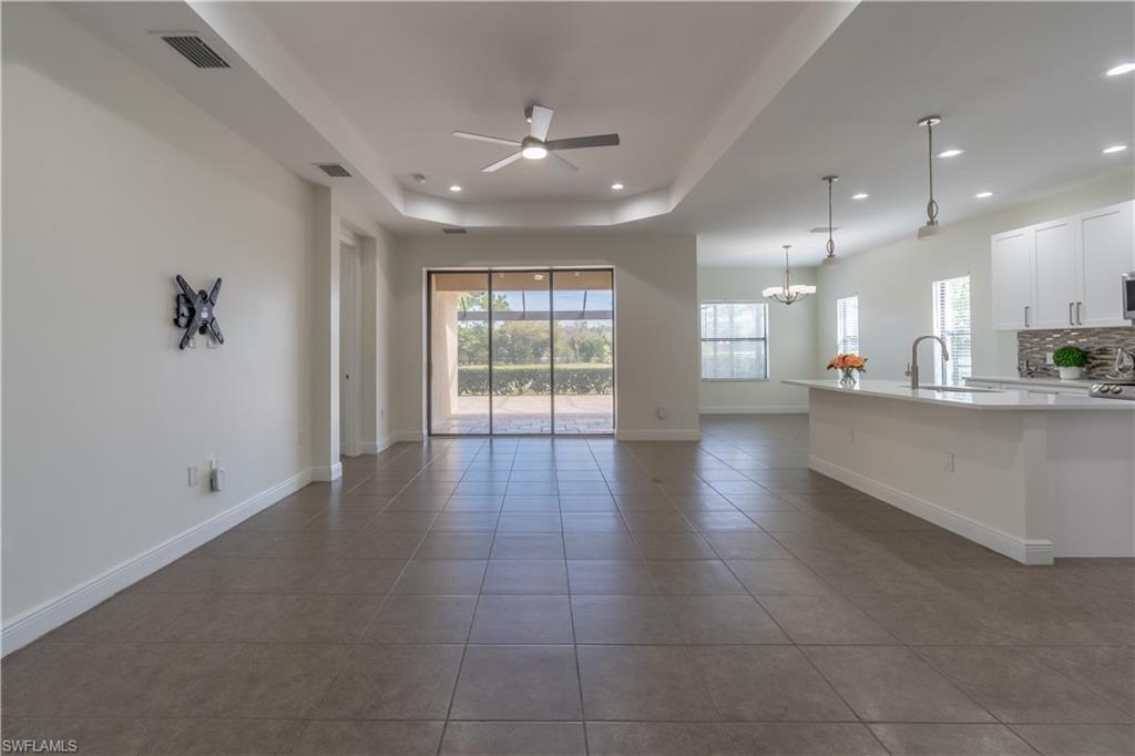 3549 Canopy Circle Naples, FL 34120 - Photo 7 of 50 a view of an empty room and a kitchen