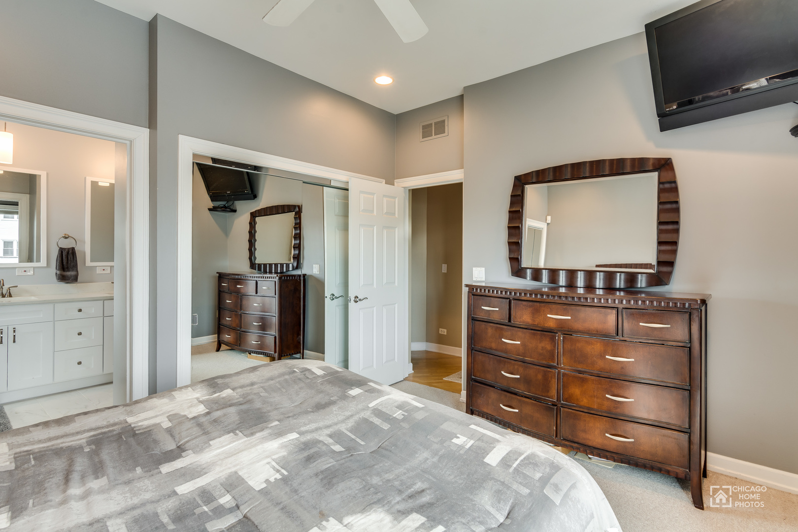 2128 West Walton Street, Unit 2E Chicago, IL 60622 - Photo 14 of 23 a bedroom with a bed and a flat screen tv