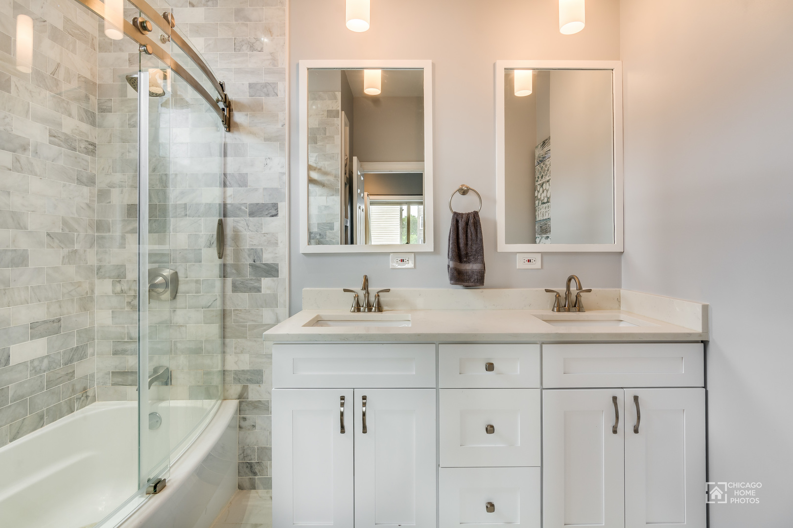 2128 West Walton Street, Unit 2E Chicago, IL 60622 - Photo 15 of 23 a bathroom with a bathtub sink vanity and mirror