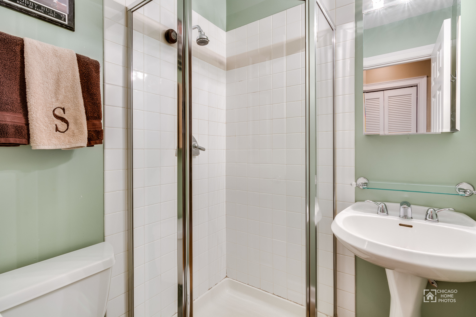 2128 West Walton Street, Unit 2E Chicago, IL 60622 - Photo 19 of 23 a bathroom with a sink a toilet and shower