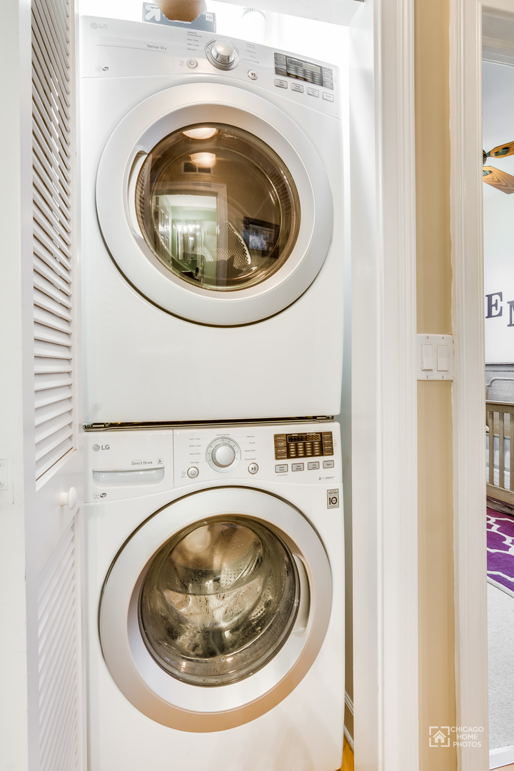 2128 West Walton Street, Unit 2E Chicago, IL 60622 - Photo 20 of 23 a utility room with dryer and washer