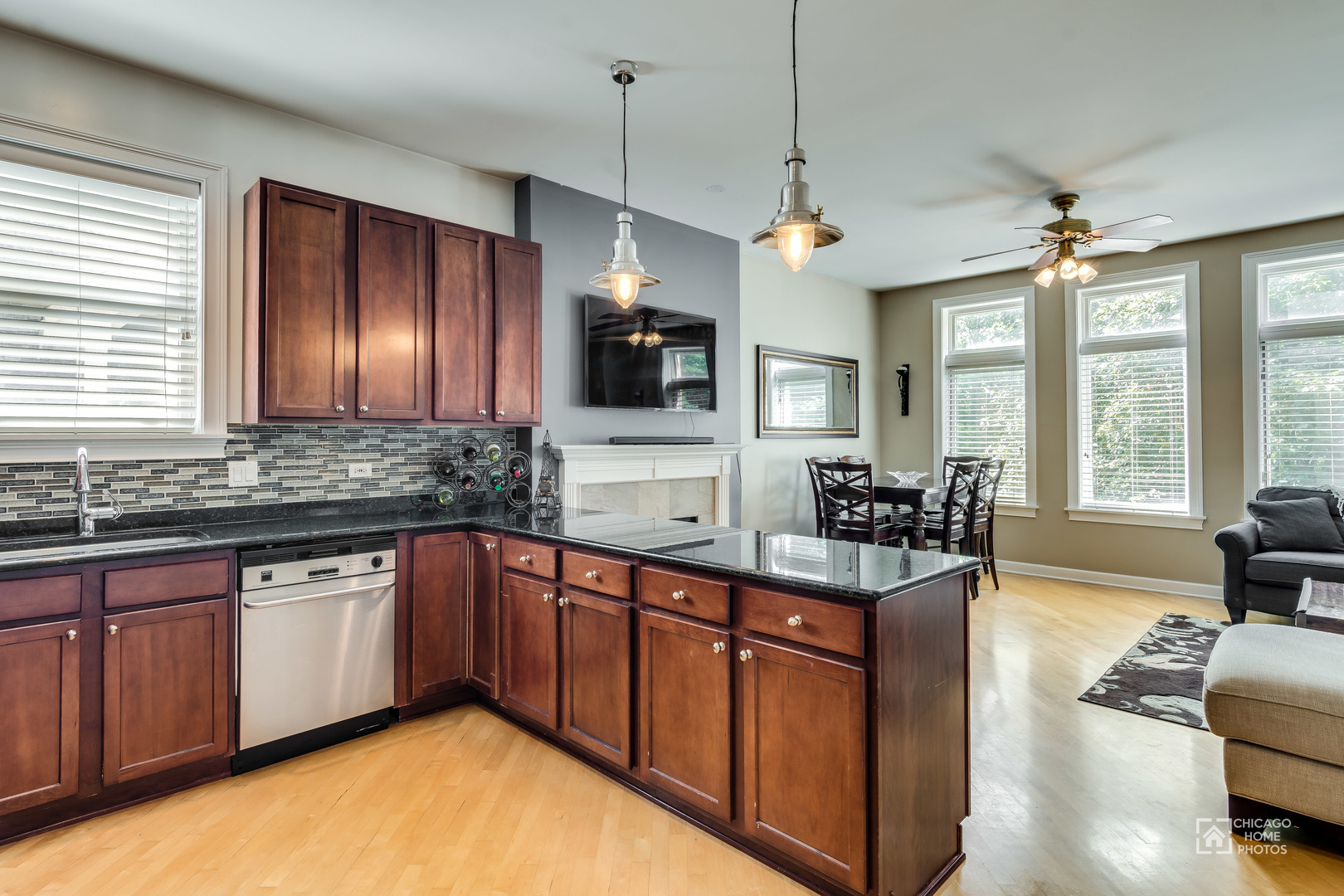 2128 West Walton Street, Unit 2E Chicago, IL 60622 - Photo 6 of 23 a large kitchen with stainless steel appliances granite countertop a sink and a stove