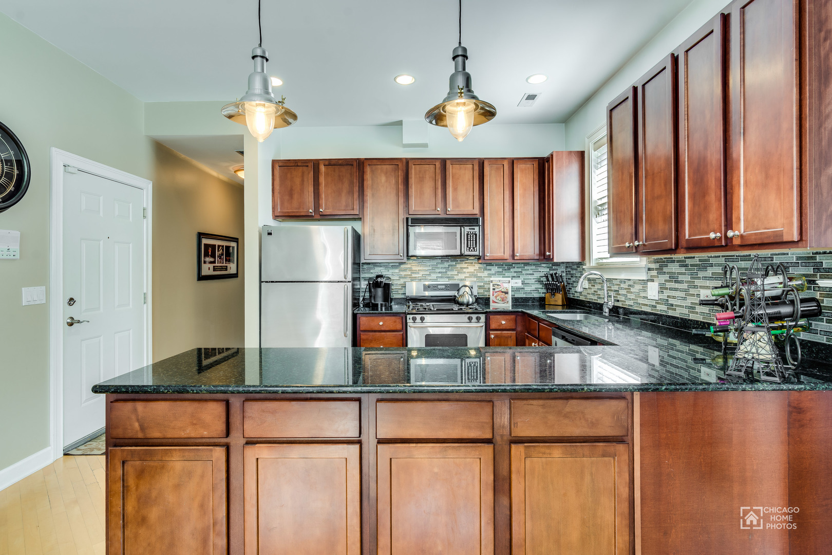 2128 West Walton Street, Unit 2E Chicago, IL 60622 - Photo 8 of 23 a kitchen with refrigerator and cabinets